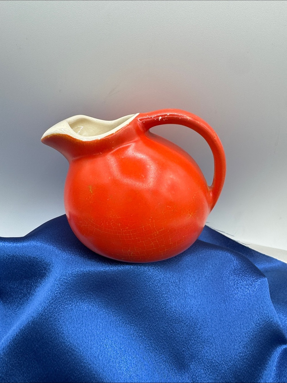 Mid-Century Modern ceramic ball pitcher, known for its iconic round shape.